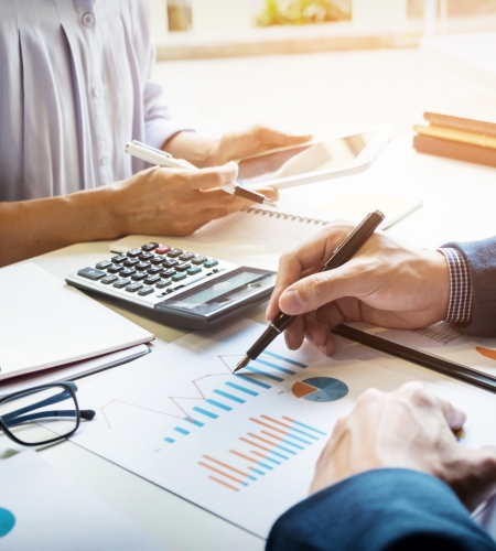 business man financial inspector and secretary making report, calculating or checking balance. Internal Revenue Service inspector checking document. Audit concept