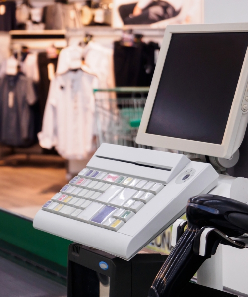 supermarket cash desk checkout counter payment terminal with blank computer monitor screen